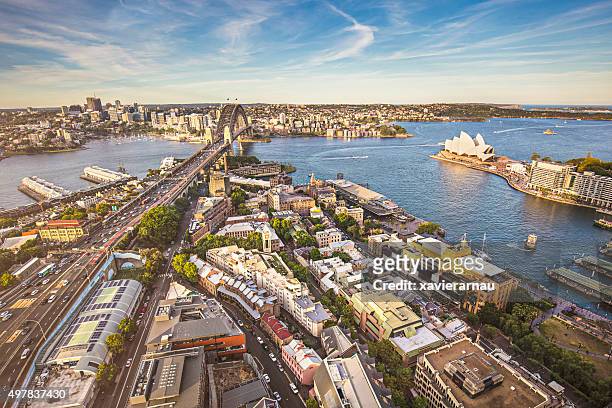 elevated panorama of sydney at sunset - sydney harbour people stock pictures, royalty-free photos & images