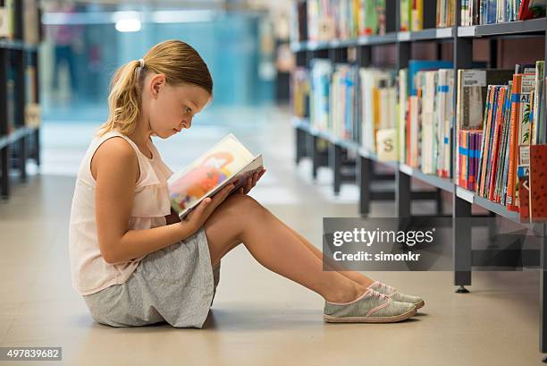 girl studying in library - sitting on ground stock pictures, royalty-free photos & images