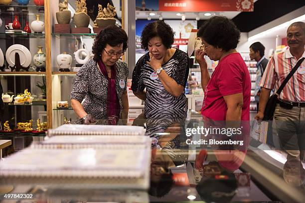 Visitors browse merchandise at the souvenir shop of the presidential palace in Taipei, Taiwan, on Wednesday, Nov. 18, 2015. President Ma Ying-jeou is...