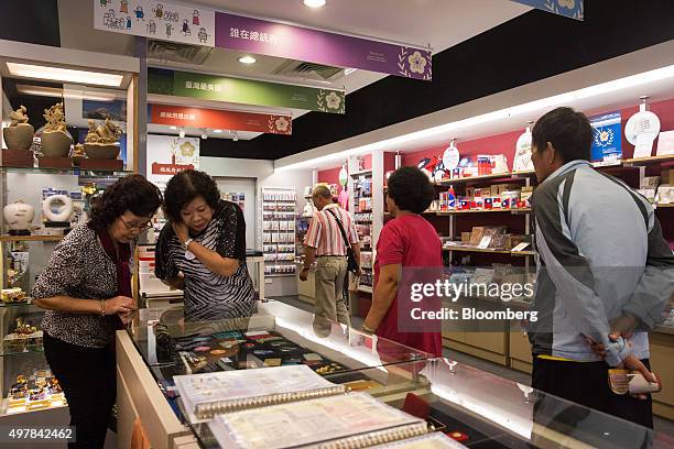 Visitors browse merchandise in the souvenir shop of the presidential palace in Taipei, Taiwan, on Wednesday, Nov. 18, 2015. President Ma Ying-jeou is...
