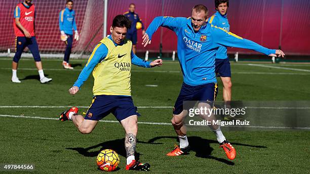 Lionel Messi and Jeremy Mathieu during a training session at Ciutat Esportiva on November 18, 2015 in Barcelona, Spain.