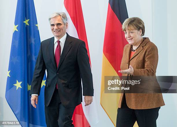 Austrian Chancellor Werner Faymann and German Chancellor Angela Merkel prepare to give a joint press conference at the German Chancellery on November...