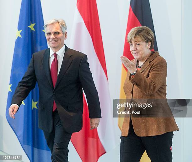 Austrian Chancellor Werner Faymann and German Chancellor Angela Merkel prepare to give a joint press conference at the German Chancellery on November...