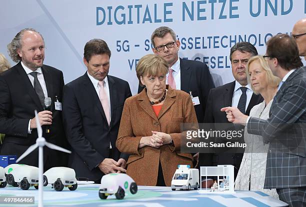 German Chancellor Angela Merkel , Vice Chancellor and Economy and Energy Minister Sigmar Gabriel , Education Minister Johanna Wanka look at a...