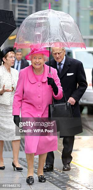 Queen Elizabeth II and Prince Philip, Duke of Edinburgh arrive for a visit to the Metroline Tramline Extension on November 19, 2015 in London,...