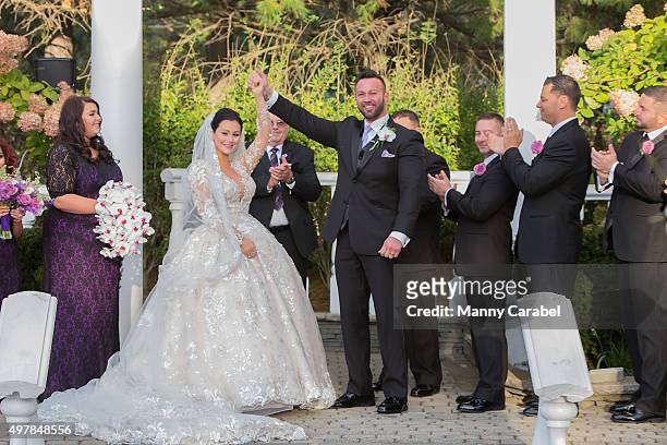 Jenni "JWoww" Farley and Roger Mathews pose for wedding photographs at their wedding at Addison Park on October 18, 2015 in Keyport, New Jersey.