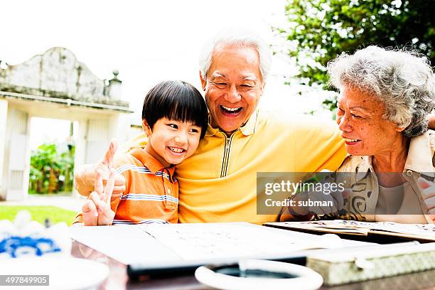 quality time - hong kong grandmother stock pictures, royalty-free photos & images