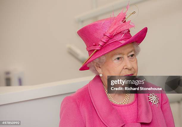 Queen Elizabeth II meets staff during a tour of the new Birmingham Hospital and School of Dentistry before officially opening the building, on...