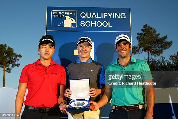 Daniel Im of the USA, Ulrich Van den Berg of South Africa and Adrian Otaegui of Spain pose with the winners trophy after all finishing jointly on -18...