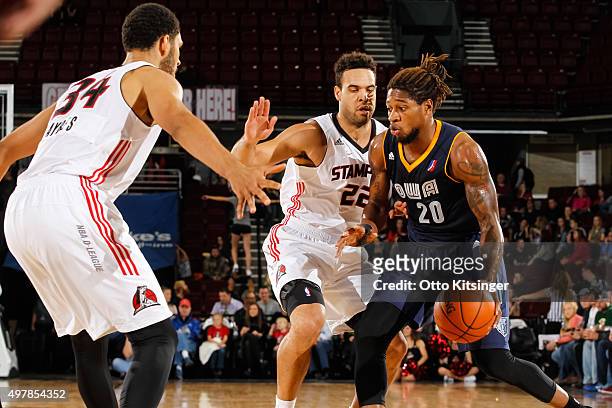 Cartier Martin of the Iowa Energy dribbles the ball around J.J. O'Brien of the Idaho Stampede during an NBA D-League game on November 18, 2015 at...
