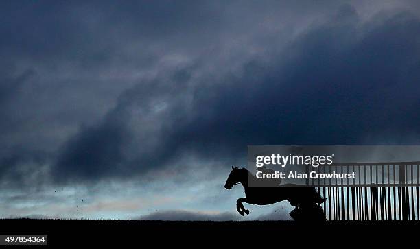 General view as a runner clears a flight of hurdles on the back straight at Wincanton racecourse on November 19, 2015 in Wincanton, England.