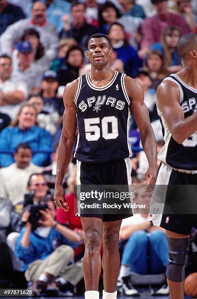 David Robinson of the San Antonio Spurs walks against the Sacramento Kings circa 1996 at Arco Arena in Sacramento, California. NOTE TO USER: User...