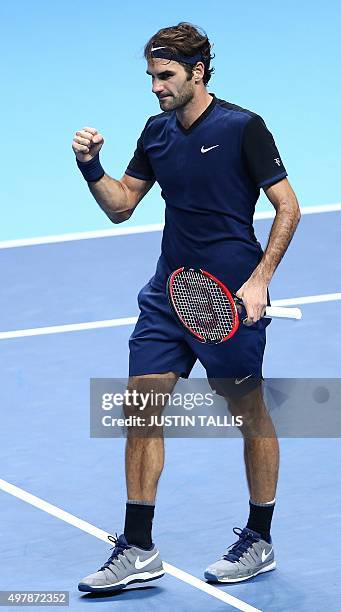 Switzerland's Roger Federer reacts after beating Japan's Kei Nishikori during a men's singles group stage match on day five of the ATP World Tour...