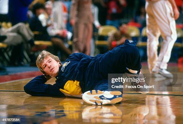 Rik Smits of the Indian Pacers in stretches prior to playing the Washington Bullets in an NBA basketball game circa 1995 at US Airways Arena in...