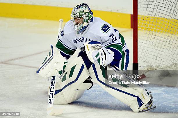Goaltender Richard Bachman of the Vancouver Canucks plays in the game against the Calgary Flames at Scotiabank Saddledome on October 7, 2015 in...
