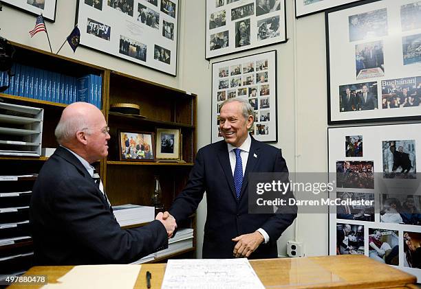 Republican Presidential candidate George Pataki greets New Hampshire Secretary of State Bill Gardner as he files paperwork for the New Hampshire...