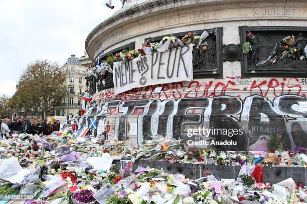 Banner reading in English "We are not afraid" is seen at a makeshift memorial for the victims of the Paris terror attacks at Place de la Republique...