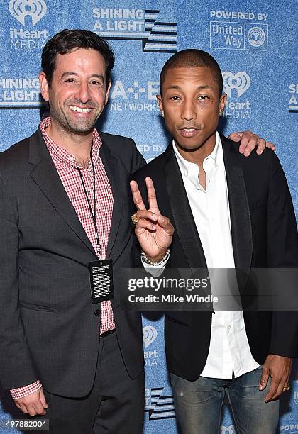 And Lifetime EVP and General Manager Rob Sharenow and Recording artist Pharrell Williams attend A+E Networks "Shining A Light" concert at The Shrine...