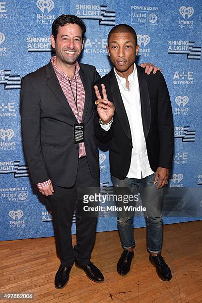 And Lifetime EVP and General Manager Rob Sharenow and Recording artist Pharrell Williams attend A+E Networks "Shining A Light" concert at The Shrine...