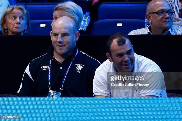 Michael Cheika and Stephen Moore watch on during the match between Roger Federer of Switzerland and Kei Nishikori of Japan on day five of the...