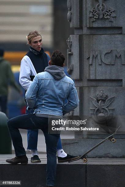 Rocco Ritchie chats to others as he plays on a skateboard on November 19, 2015 in Turin, Italy.