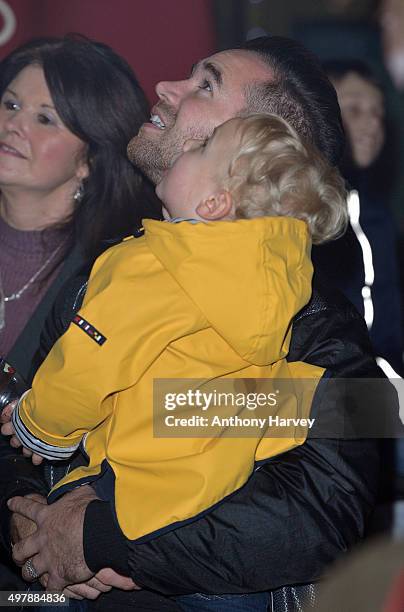 Kieran Hayler and son Jett Riviera watch as Katie Price switches on the Woking SHopping Christmas Lights at on November 19, 2015 in Woking, England.