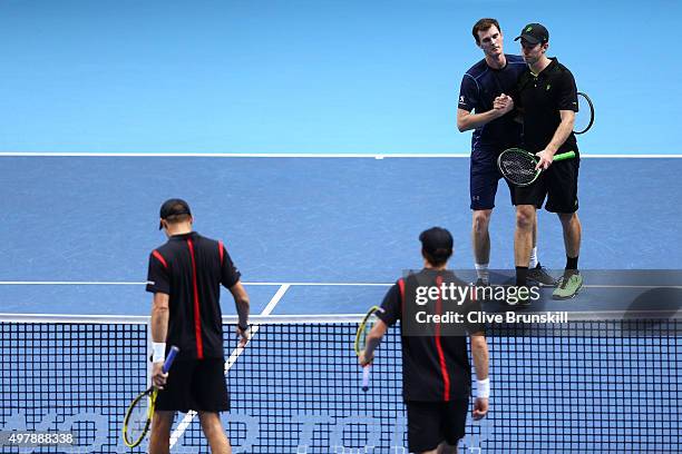 Jamie Murray of Great Britain and John Peers of Australia look dejected after losing to Mike Bryan of the USA and Bob Bryan of the USA in their men's...