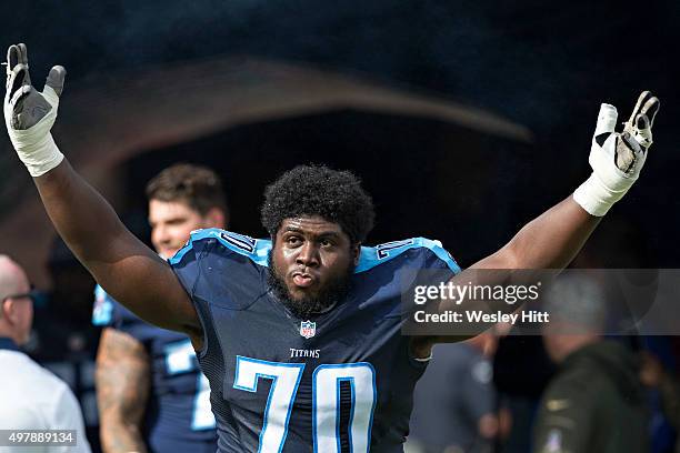 Chance Warmack of the Tennessee Titans runs onto the field before a game against the Carolina Panthers at Nissan Stadium on November 15, 2015 in...