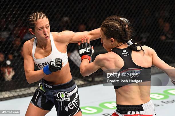 Jessica Penne sqaures off with Joanna Jedrzejczyk in their women's strawweight championship bout during the UFC Fight Night event at the O2 World on...