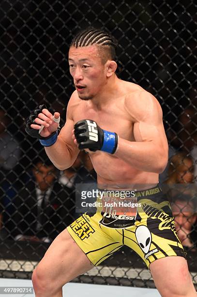 Tatsuya Kawajiri squares off with Dennis Siver in their featherweight bout during the UFC Fight Night event at the O2 World on June 20, 2015 in...