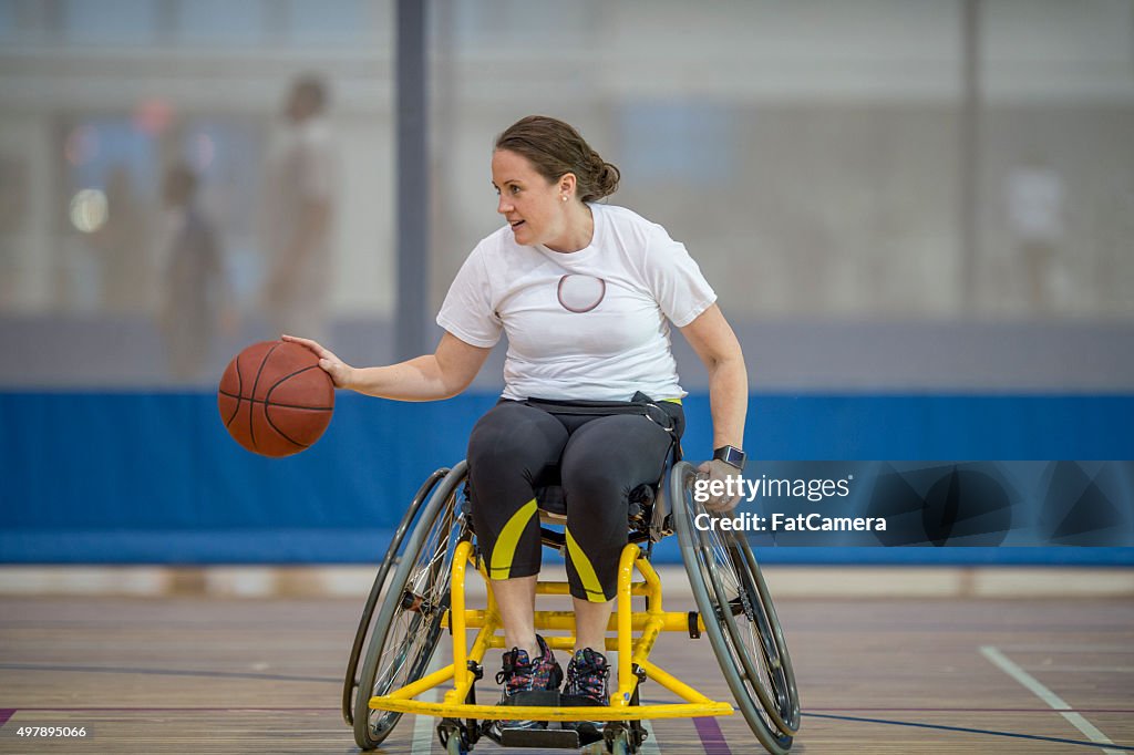 Woman in a Wheelchair Playing Basketball