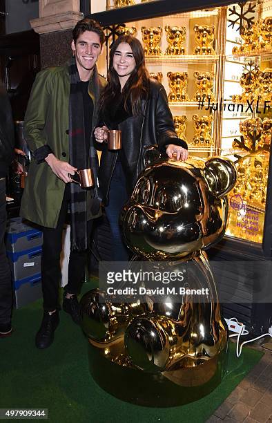 Issac Carew and Dua Lipa attend the Mount Street Christmas Lights switch on hosted by Linda Farrow featuring the launch of Julian The Bear, the Linda...