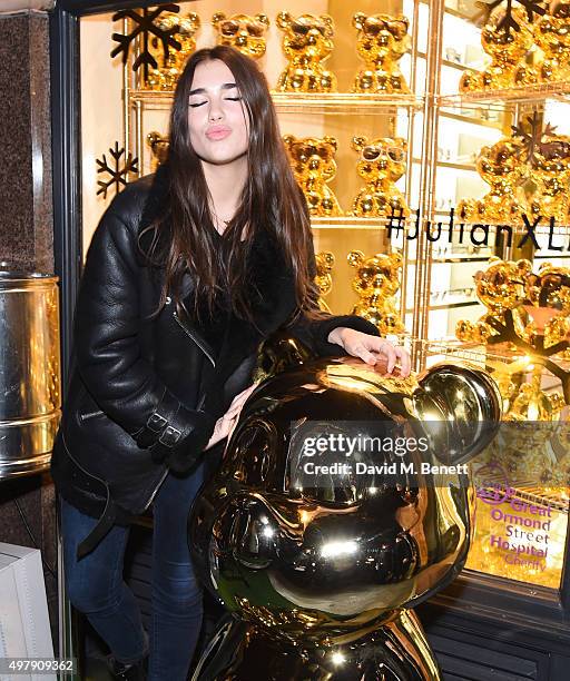 Dua Lipa attends the Mount Street Christmas Lights switch on hosted by Linda Farrow featuring the launch of Julian The Bear, the Linda Farrow Holiday...