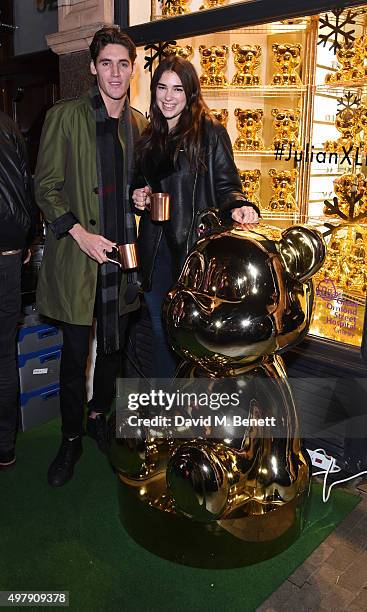 Issac Carew and Dua Lipa attend the Mount Street Christmas Lights switch on hosted by Linda Farrow featuring the launch of Julian The Bear, the Linda...