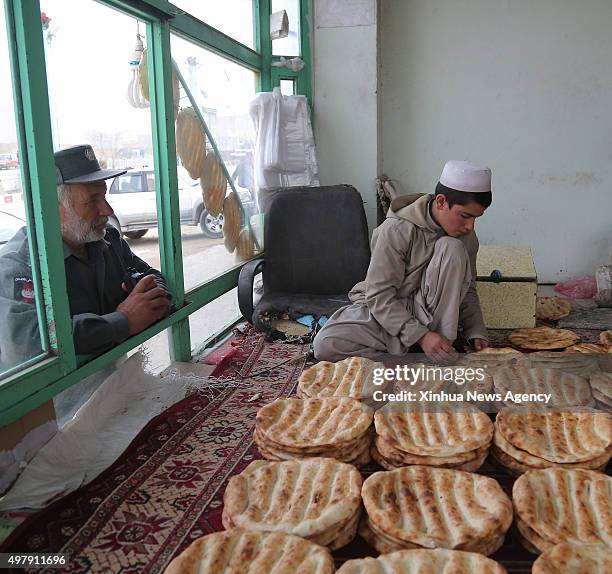 Nov. 19, 2015-- An Afghan man prepares bread for sell at a bakery in Wardak province, Afghanistan, Nov. 19, 2015.