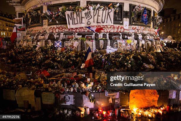 Flowers, candles and messages left as a memorial in "Monument à la République" in the 11th district of Paris, following a series of coordinated...