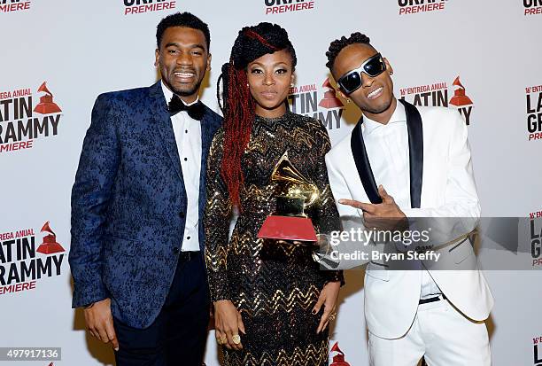 Musicians Carlos "Tostao" Valencia, Gloria "Goyo" Martinez and Miguel "Slow" Martinez of ChocQuibTown attend the 16th Latin GRAMMY Awards at the MGM...