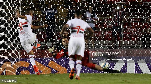 Luis Fabiano of Sao Paulo scoring the fourth goal during the match between Sao Paulo and Atletico MG for the Brazilian Series A 2015 at Estadio do...