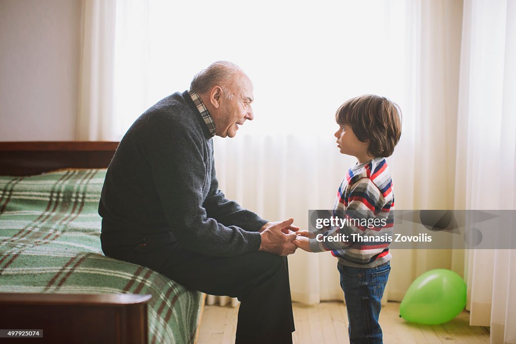 Grandfather talking to his grandson