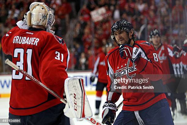 Alex Ovechkin of the Washington Capitals celebrates his third period goal with goalie Philipp Grubauer against the Dallas Stars at Verizon Center on...