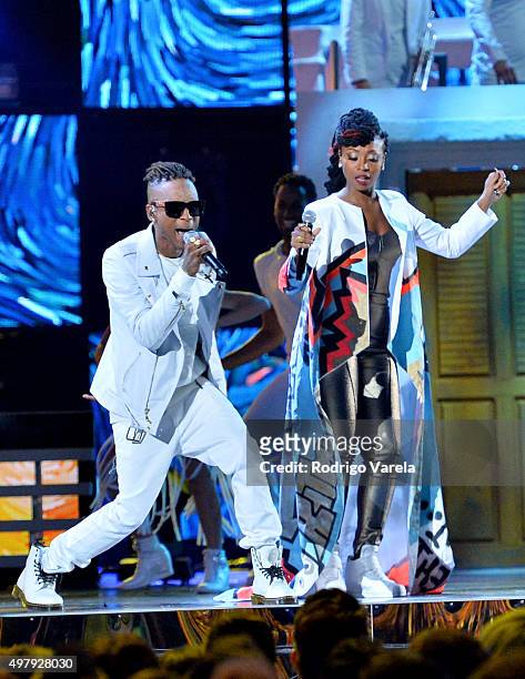 Recording artists Miguel 'Slow' Martinez and Gloria 'Goyo' Martinez of music group ChocQuibTown perform onstage during the 16th Latin GRAMMY Awards...