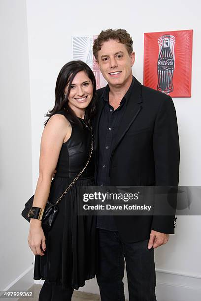 Pop Artist Burton Morris and wife attend the Sheila Rosenblum Resident Magazine Cover Party at Soho Contemporary Art Gallery on November 19, 2015 in...