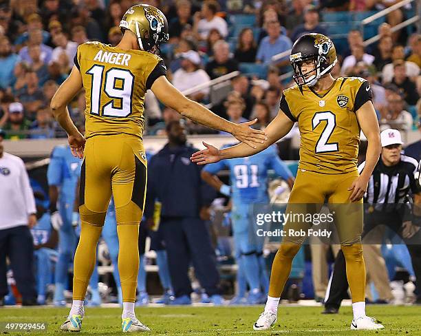 Jason Myers celebrates with Bryan Anger of the Jacksonville Jaguars after kicking a field goal during the second quarter of the game against the...