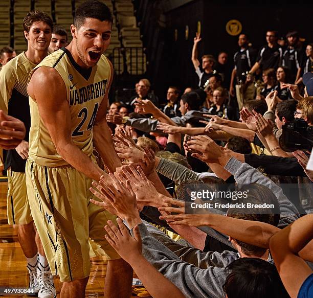 Nolan Cressler of the Vanderbilt Commodores high fives fans after a 79-72 overtime victory over the Stony Brook Seawolves at Memorial Gym on November...