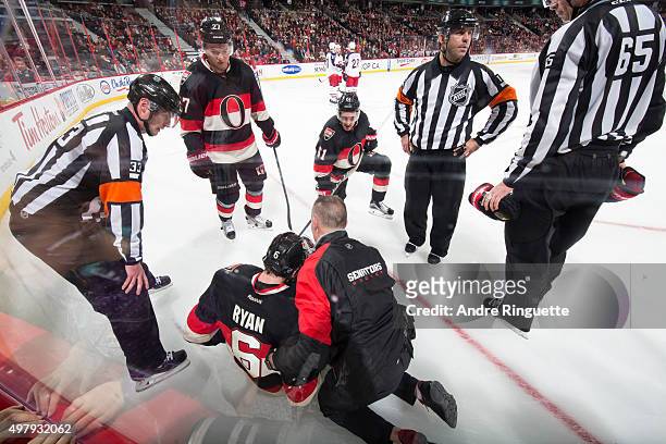 Bobby Ryan of the Ottawa Senators is tended to by athletic therapist Gerry Townend after an injury in a game against the Columbus Blue Jackets as...