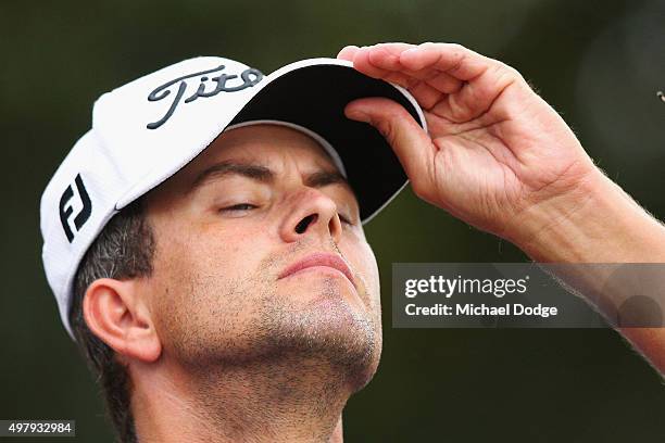 Adam Scott of Australia reacts after missing a putt during day two of the 2015 Australian Masters at Huntingdale Golf Club on November 20, 2015 in...