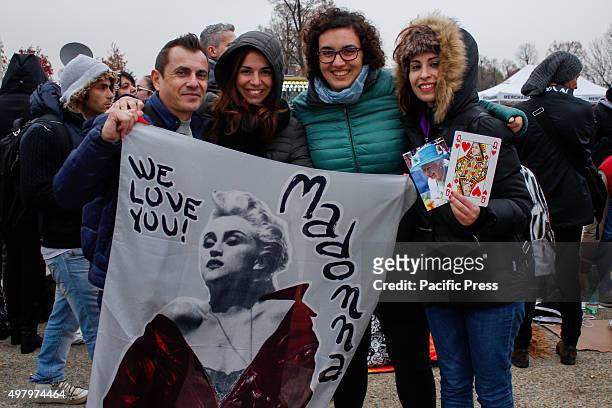 Fans outside the Pala Alpitour for the Rebel Heart Tour of Madonna with a flag of Miss Ciccone.