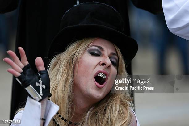 Madonna lookalike poses for the photographer outside the arena where the singer Madonna will perform for three day with her Rebel Heart Tour.