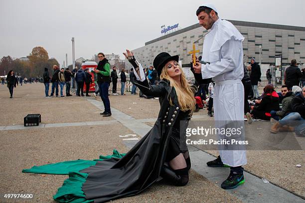 Madonna lookalike with the Brazilian cosplayer Rinaldo Borba dressed as pope, poses for the photographer outside the arena where the singer Madonna...