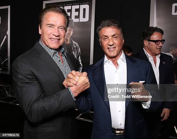 Arnold Schwarzenegger and Producer Sylvester Stallone attend the premiere of Warner Bros. Pictures' "Creed" at Regency Village Theatre on November...